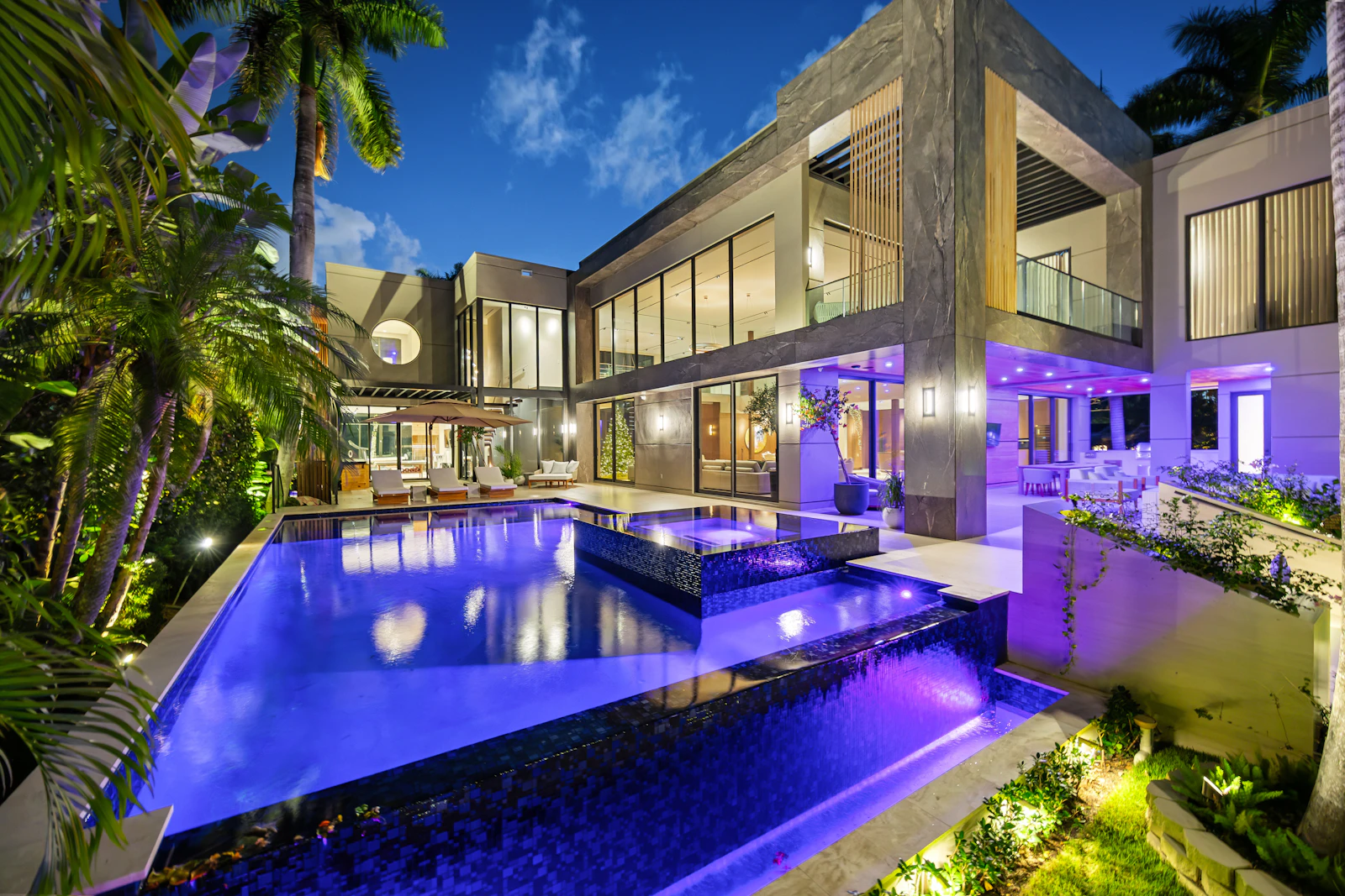 Villa Aika, Miami: pool terrace and modern facade lit at dusk